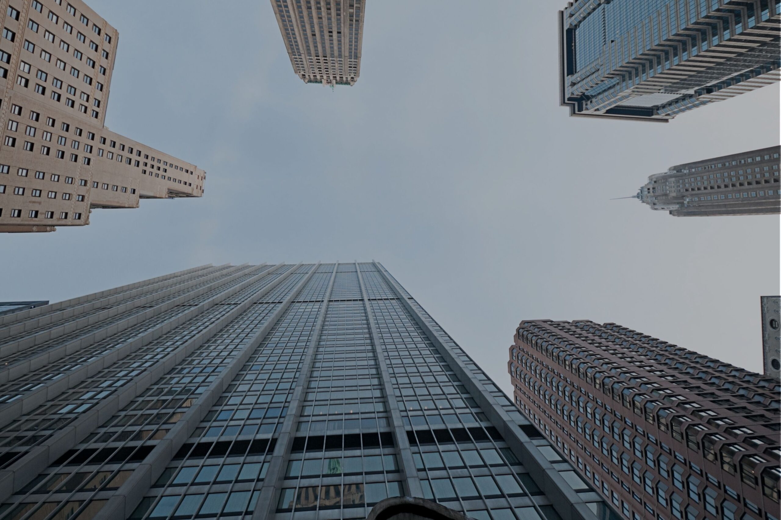 Corporate office towers, representing head office and executive search roles in mining